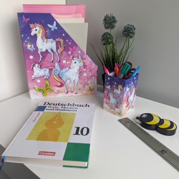 Application image of a pencil holder and a desk organizer featuring a unicorn design.
