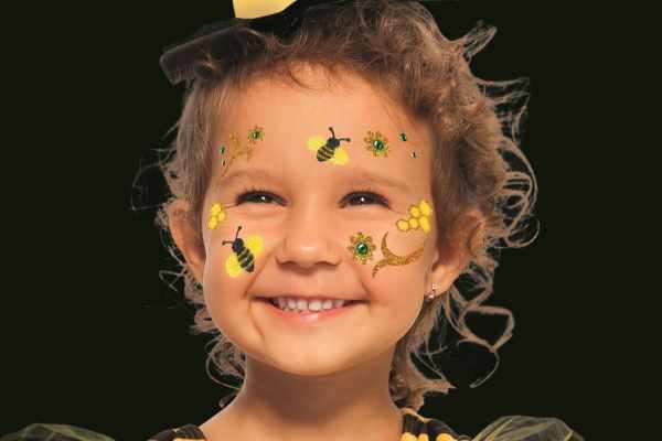 Child with bee face art stickers