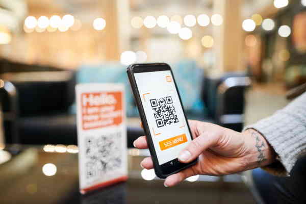 Scan the QR code at the restaurant.