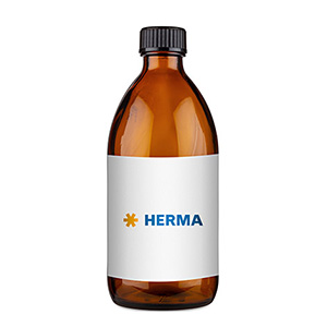 Brown glass bottle with a white label that says 'HERMA' in blue lettering.