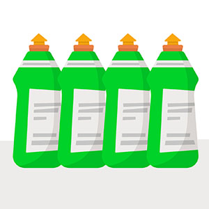 Four green bottles with orange caps containing cleaning agents. The labels are partially visible.