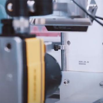 A machine with a yellow part and a date stamp showing June 22, 2020, is in focus.