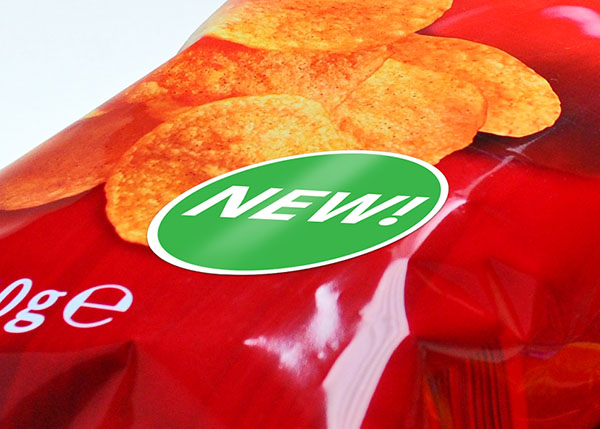 New chip packaging featuring crispy chips and a bright green 'NEW!' sticker.