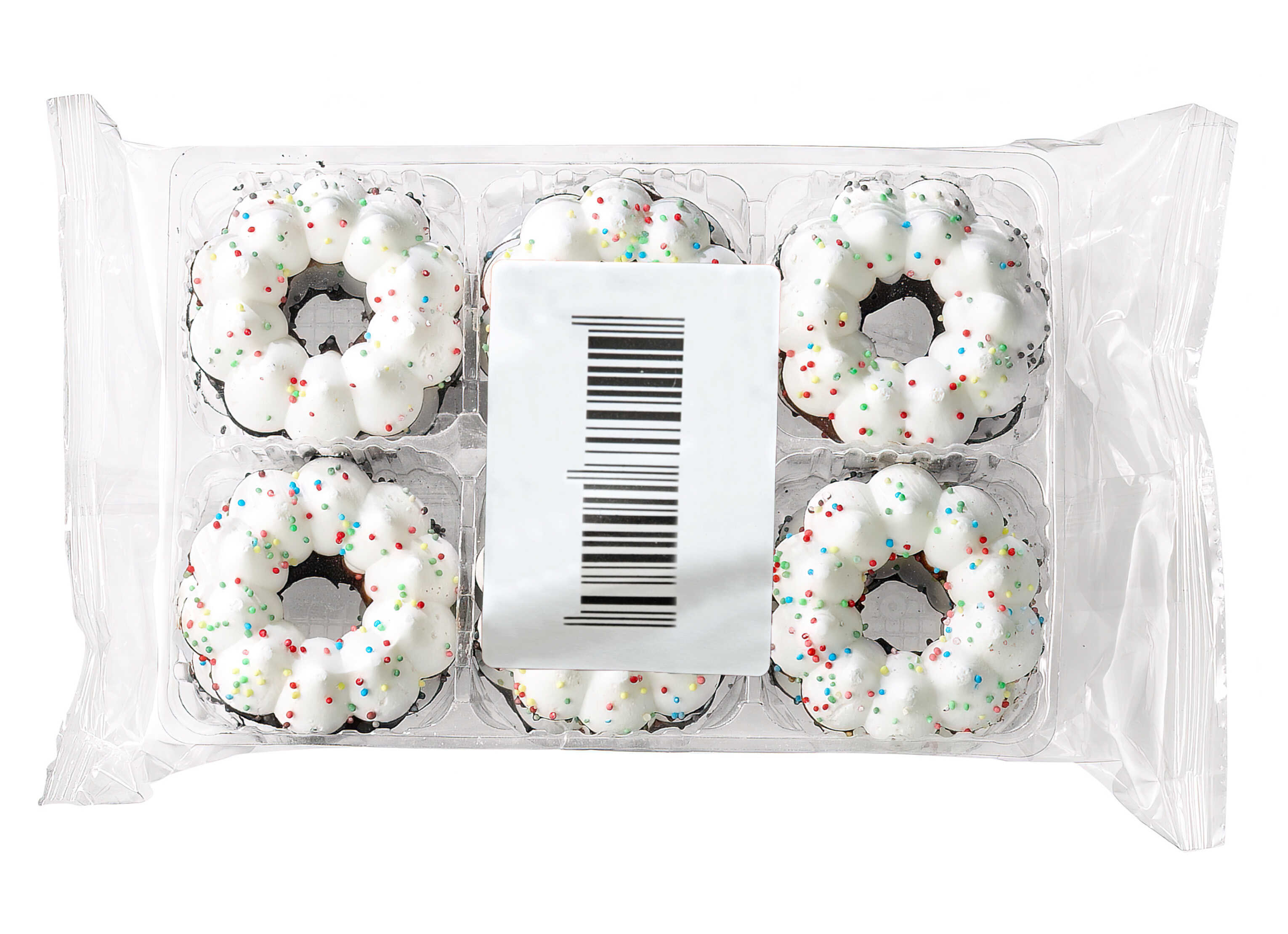 Six small donuts with white icing and colorful sprinkles in a clear package.
