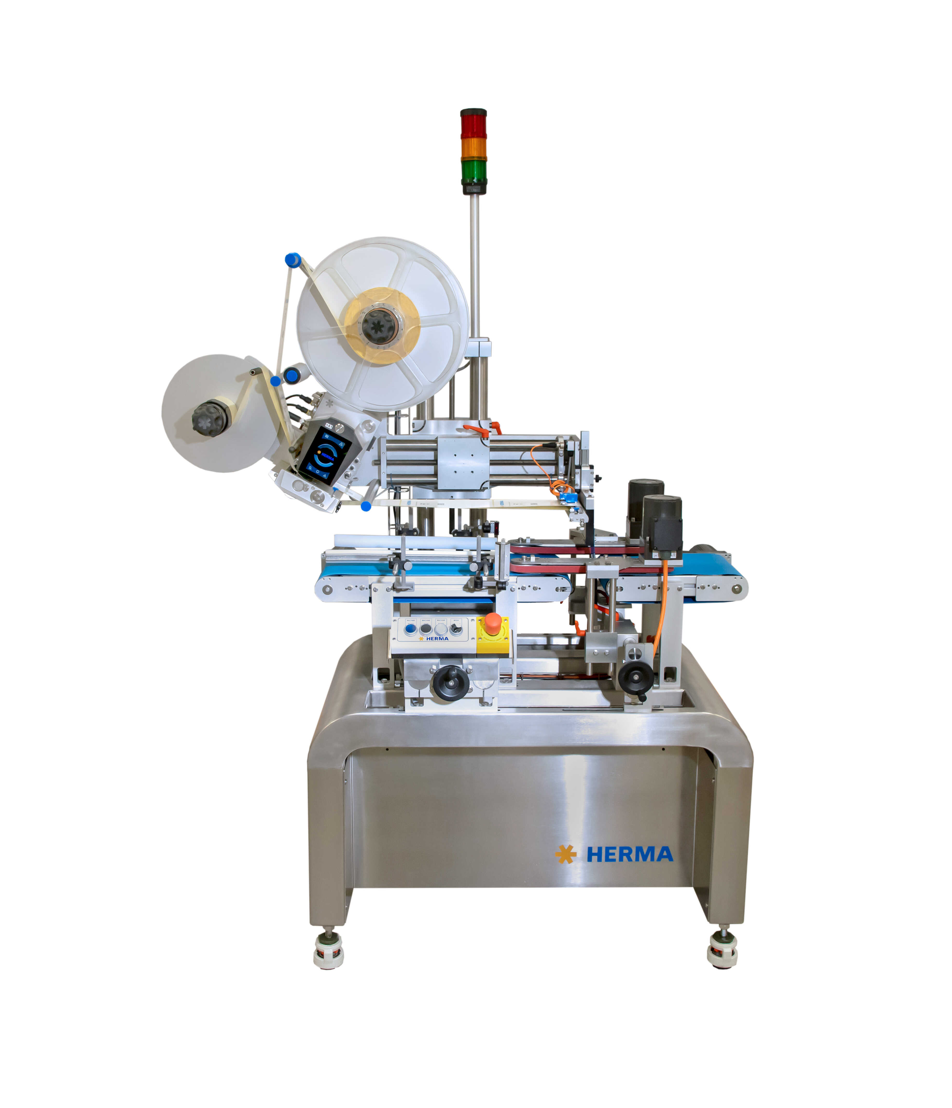 Labeling machine with multiple rolls, control unit, and safety lights, mounted on a sturdy table.