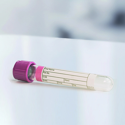 A blood collection tube with a purple cap, labeled with space for patient information such as name and date of birth.
