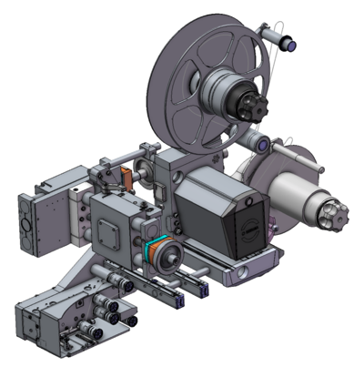 Technical drawing of a film projector machine with various mechanical components and a large drive wheel.
