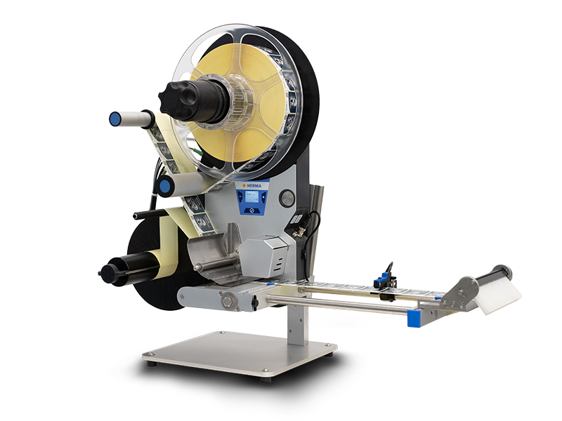 Labeling machine with rollers, a control panel, and a label dispensing mechanism. Ideal for industrial applications.