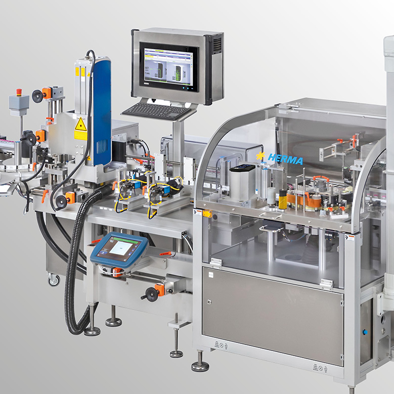 Automated packaging machine with a monitor, control elements, and a transparent casing for monitoring the packaging process.
