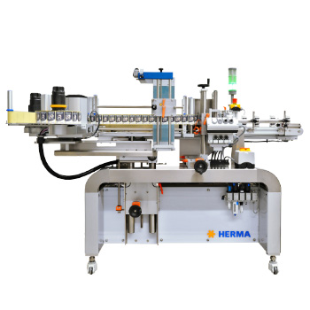 Automatic labeling machine from HERMA, equipped with multiple stations for labeling bottles or containers.