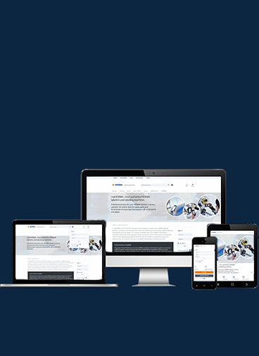 Several electronic devices display a webpage with information on vehicle technologies and safety.