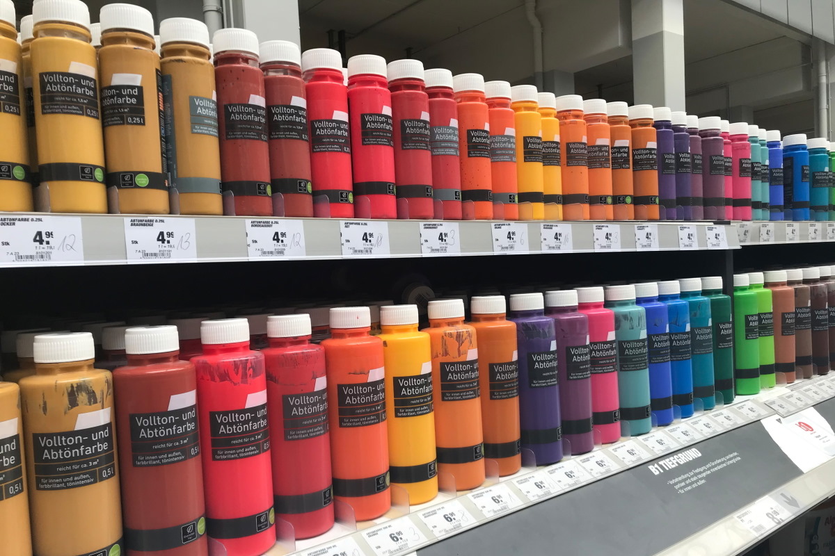 Solutions for the Construction Materials Sector: Digital Print Labels on Colorful Bottles in the Hardware Store Aisle