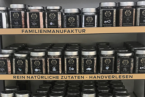 Order roll labels online in digital printing: Spice jars with spice labels on the shelf.