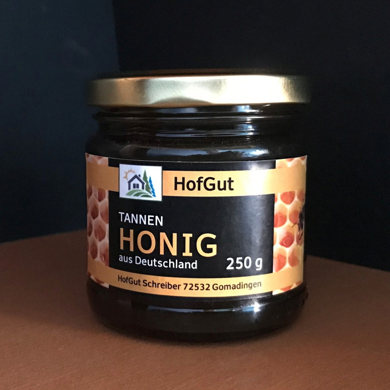 Order roll labels online in digital printing: Honey label on glass on the shelf.