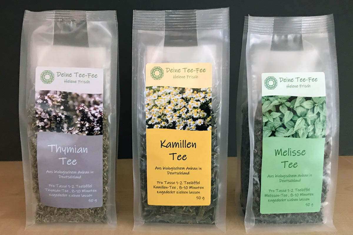 Order roll labels online in digital printing: Tea labels on 3 tea packages against a light background.