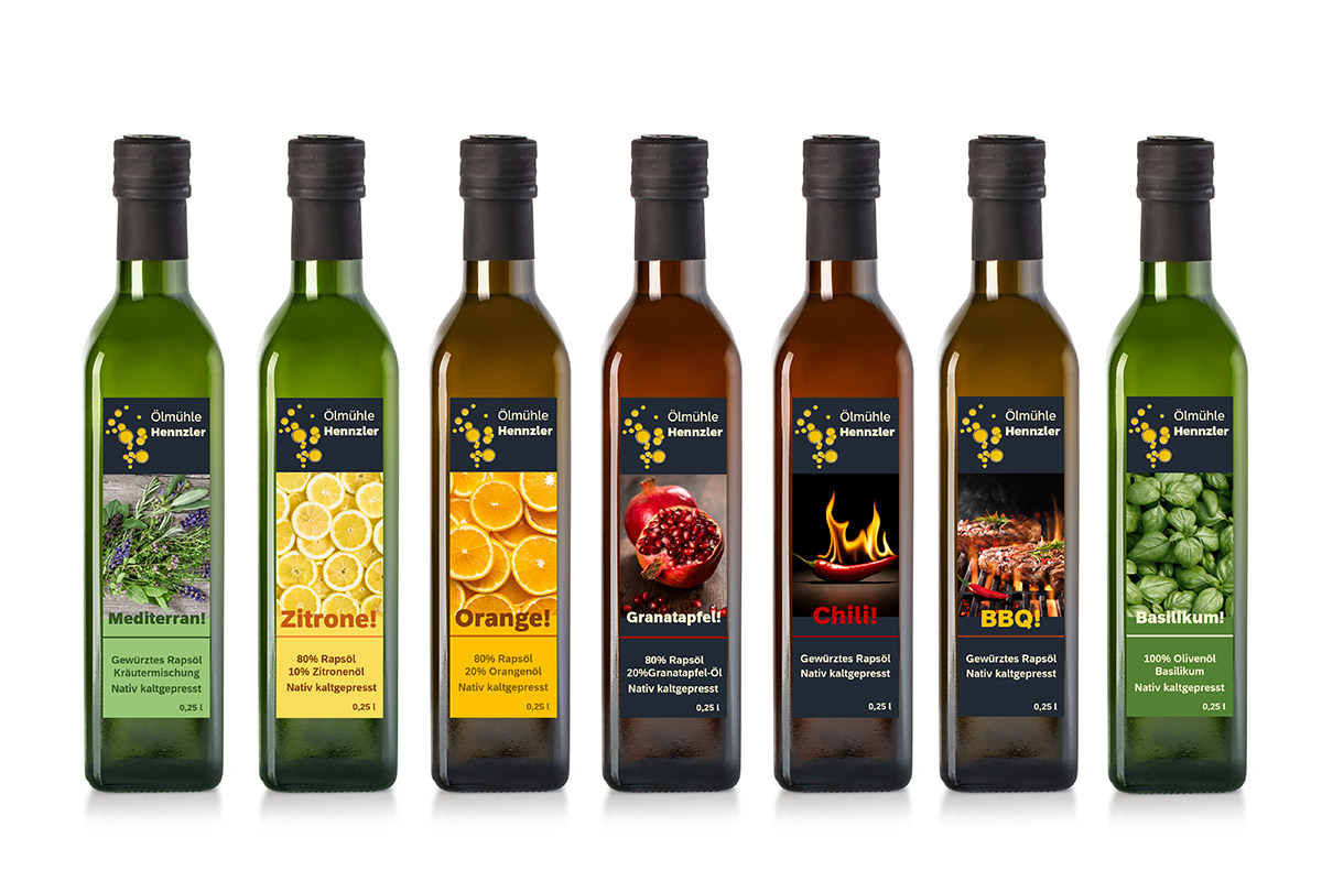 Order roll labels online in digital printing: various oil labels on bottles.