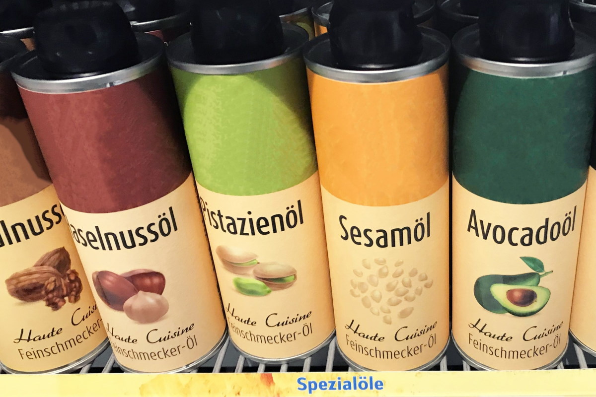 Order roll labels in digital printing online: various types of oils in cans.