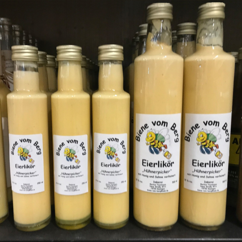 Order roll labels online in digital printing: Eggnog labels on bottles on the shelf.