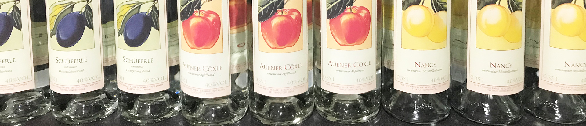 Order roll labels online in digital printing: Snap labels on bottles on the shelf, landscape format.