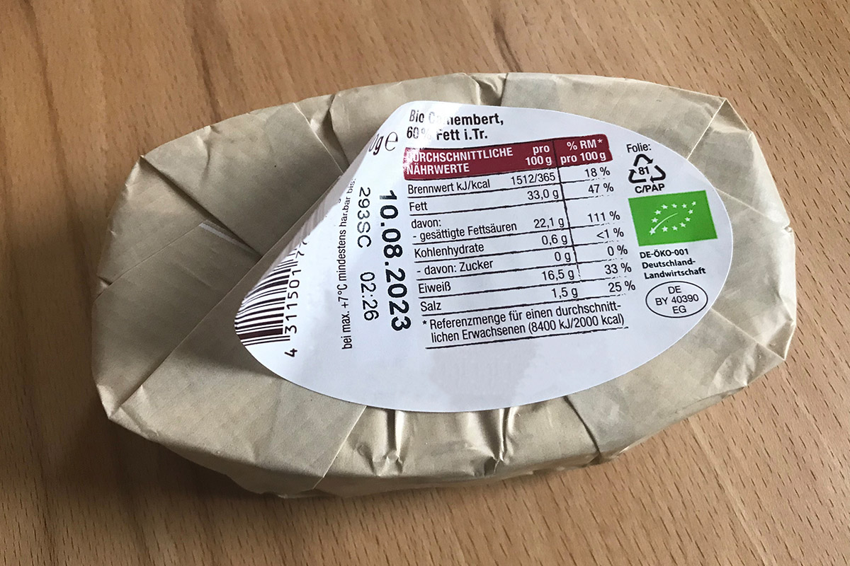 Food Solutions: Two-in-one product and closure label, pre-printed in color, later printed with thermal transfer including content, MHC, barcode, on cheese packaging.