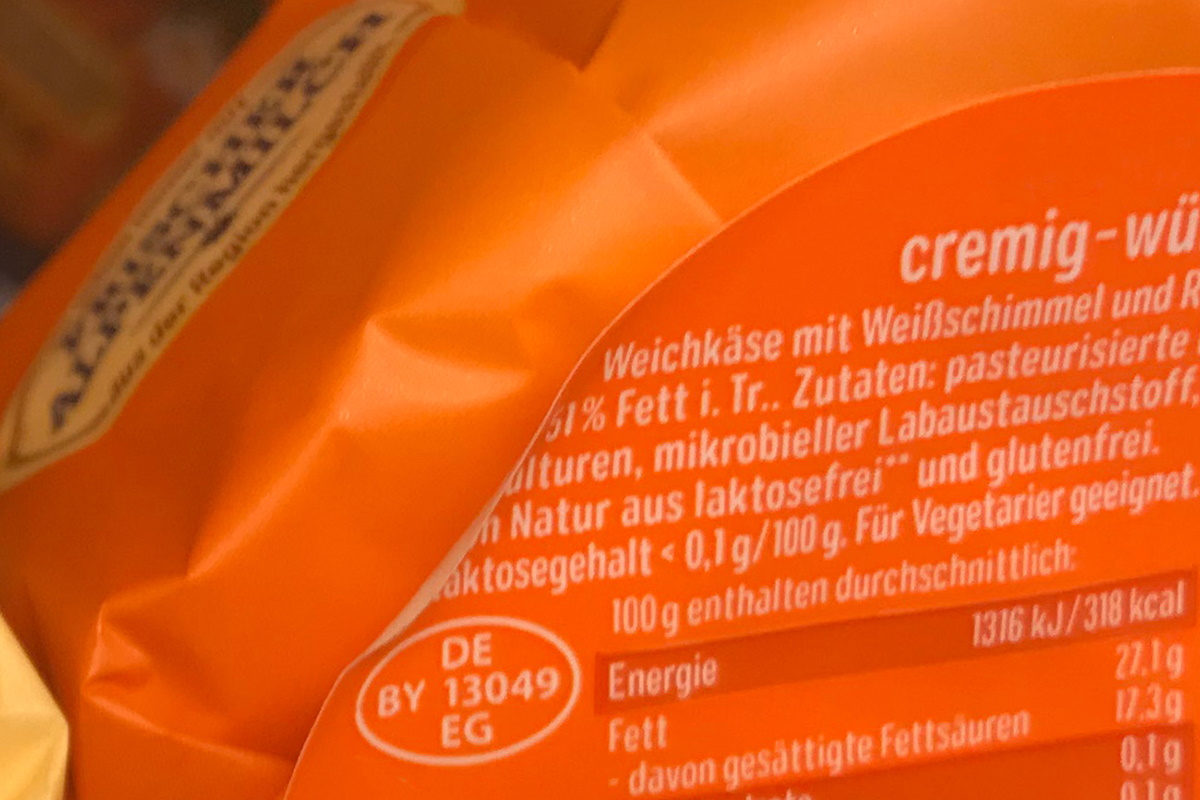 Food Solutions: Two-in-one product and closure label, pre-printed in color, later printed with thermal transfer including content, MHC, barcode, on cheese packaging.