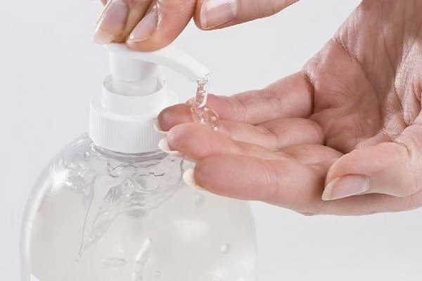 Hand sanitizer dispenser with two hands