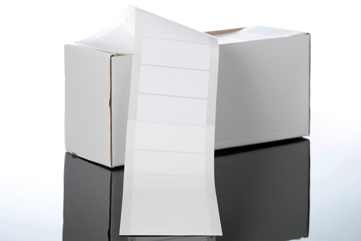 Blank labels: Stack of HERMA folded labels, also known as computer labels or perforated labels.