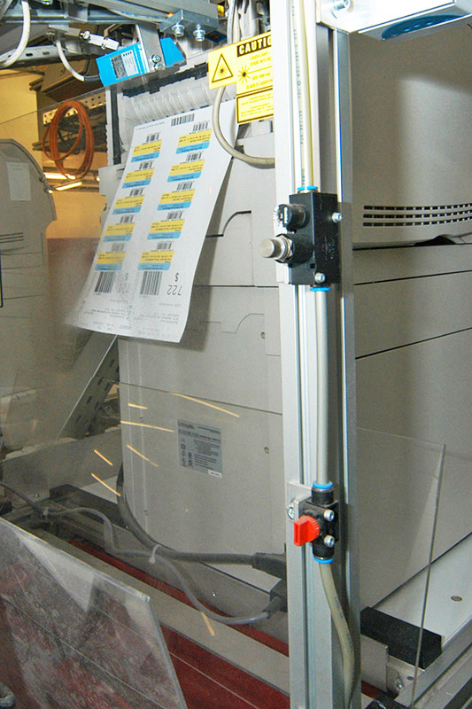 Removable book labels at KNV, sheet labels at the printer in the picking area.