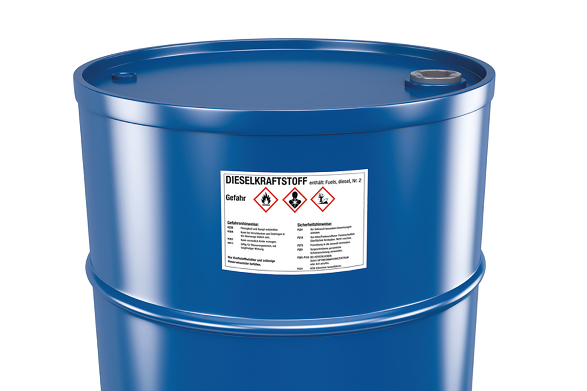 Hazardous substance and hazardous goods labels: Hazardous substance label on a blue steel drum, close-up.