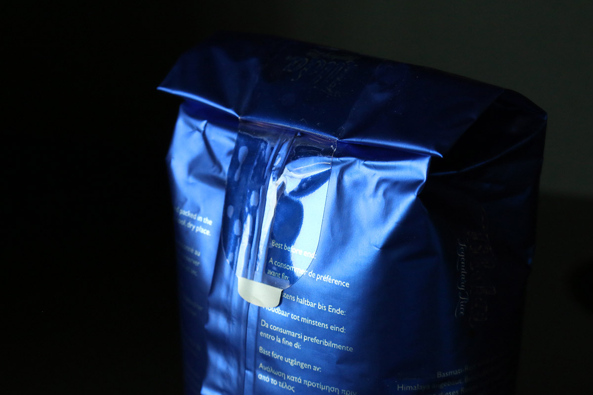 Closure labels: Transparent resealable label on a blue rice package.