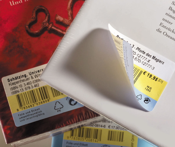 Peelable book label on a book spine, one corner has come loose.
