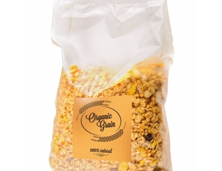 A transparent bag of granola, labeled 'Organic Grain' and '100% Natural.' The mix contains various types of grains and dried fruits.