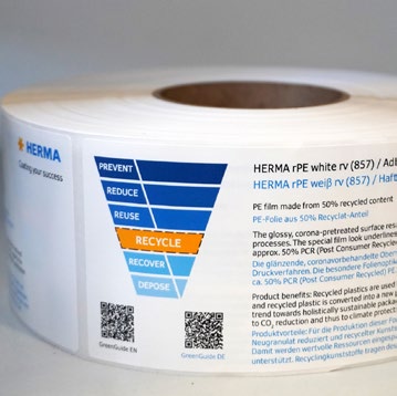 Roll of self-adhesive PE film made from 50% recycled material, labeled with recycling information and instructions.