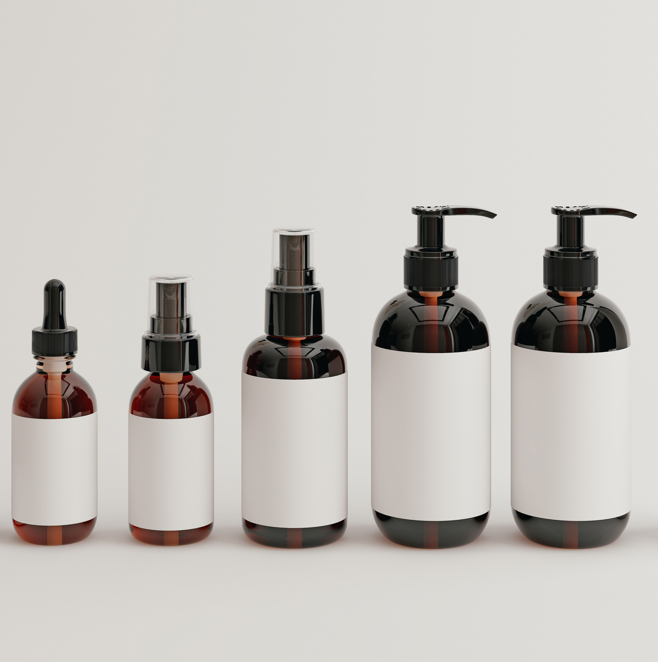 Five brown bottles with white labels in various sizes, including dropper and pump dispenser bottles.