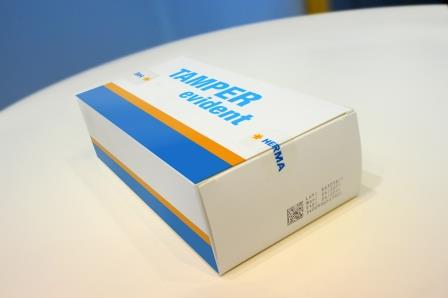 Packaging with the label 'TAMPER evident' in blue text on a white background, featuring an orange stripe.