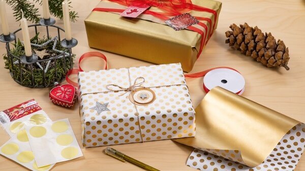 Various gift stickers on Christmas presents.