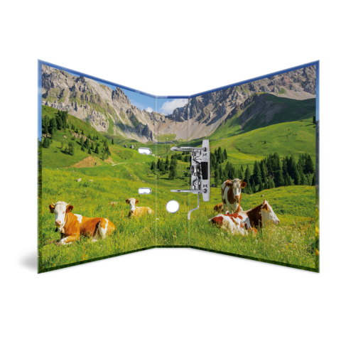 An open folder featuring a landscape that shows cows in a meadow in front of mountains. Green fields and clear skies are visible.