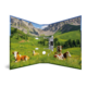 An open folder featuring a landscape that shows cows in a meadow in front of mountains. Green fields and clear skies are visible.