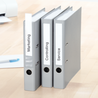 Three binders with printed spine labels.