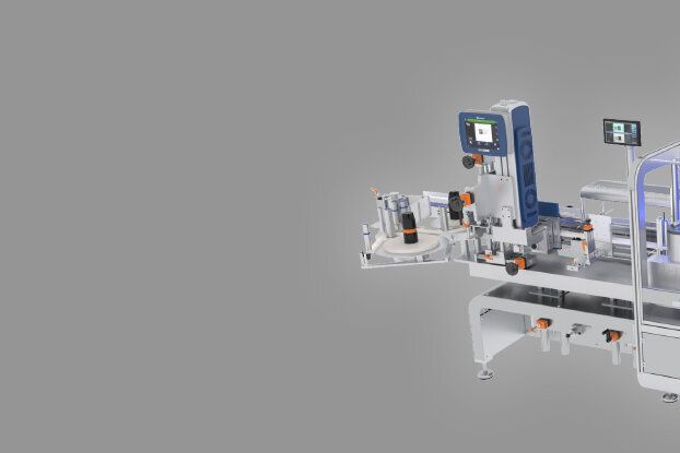 Automated production machine with a conveyor belt, control unit, and various mechanical components for processing materials.