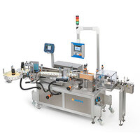 Automatic labeling machine with multiple stations, equipped with screens for controlling and monitoring the labeling process.