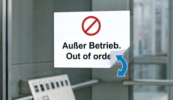 Removable label with the print 'Out of Service' on the elevator door.