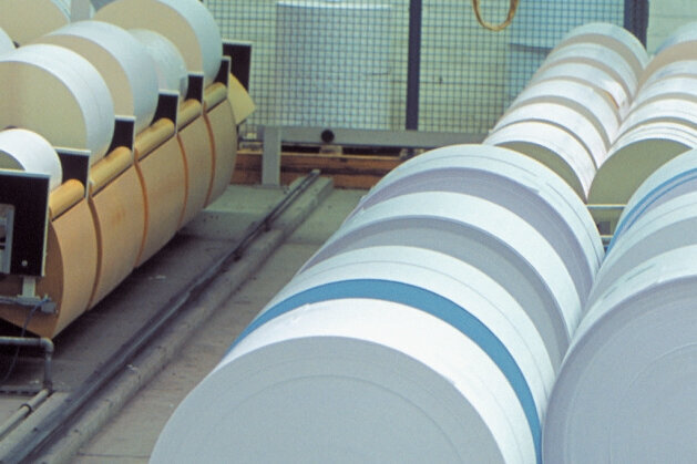 Adhesive material rolls in the trimming machine
