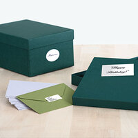 Gold and silver labels stuck on gift wrap and envelopes.