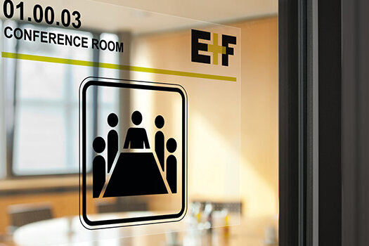 Transparent label on the glass panel of a conference room.
