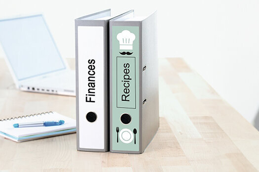 Binder with labels stuck on the desk