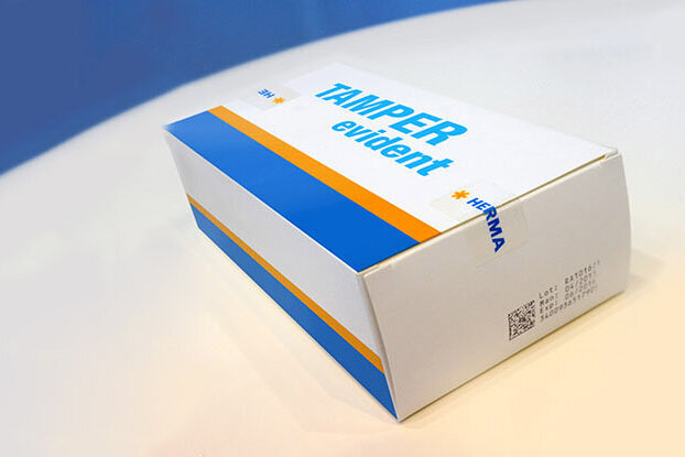 Tamper Evident Label on HERMA packaging, original seal, landscape format.