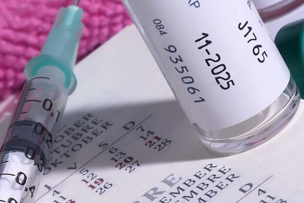 HERMA documentation labels in use on syringes and vaccine vials, landscape format.