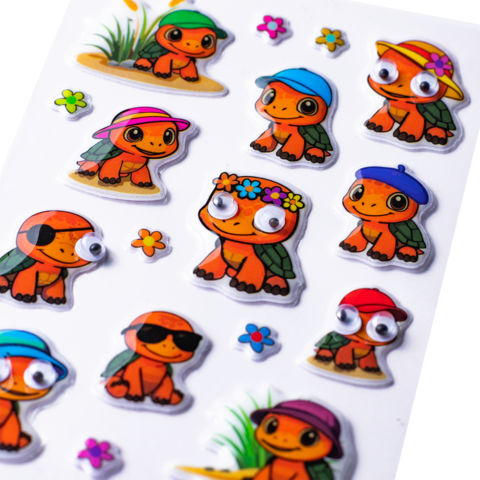 Colorful stickers of turtles wearing various hats and different accessories, including flowers and sunglasses.