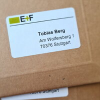 Natural brown envelope with a printed label made from recycled material.